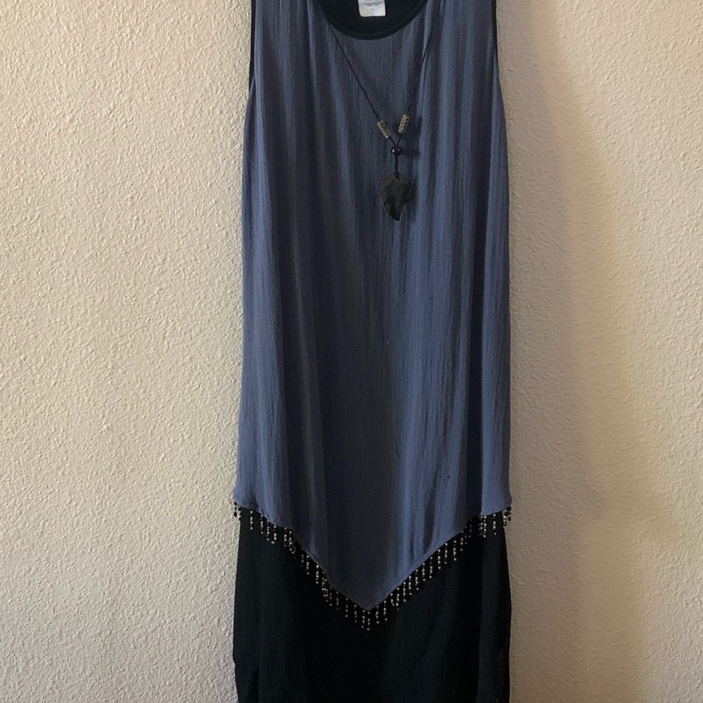 Boho? Ethnic? Dressy? This dress is all about the accessories. Drapes well.